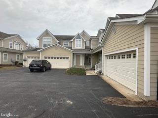 view of front of property with driveway and an attached garage