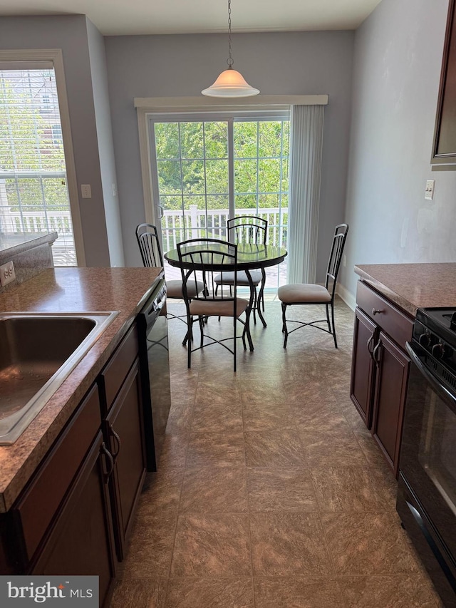2114 Split Creek Ln, Hanover, MD 21076 - kitchen with black appliances, healthy amount of natural light, hanging light fixtures, and dark brown cabinetry