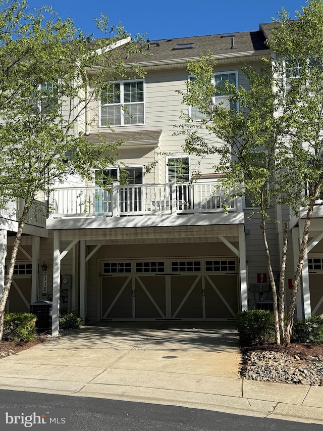 2114 Split Creek Ln, Hanover, MD 21076 - view of front of property with an attached garage, concrete driveway, and a balcony