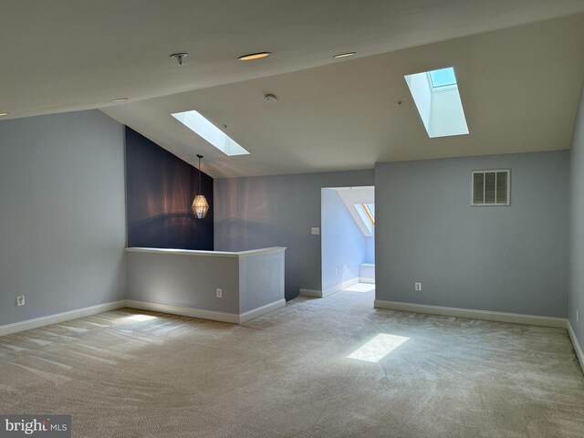 2114 Split Creek Ln, Hanover, MD 21076 - carpeted spare room featuring a skylight, vaulted ceiling, a smoke detector, and plenty of natural light