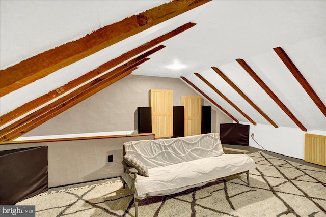 sitting room with vaulted ceiling with beams and radiator heating unit