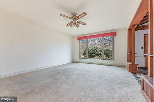 carpeted empty room with ceiling fan