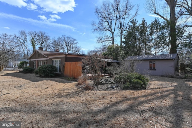 view of side of property featuring a chimney