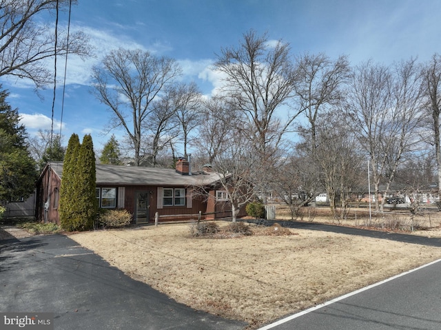 view of front of home with a chimney