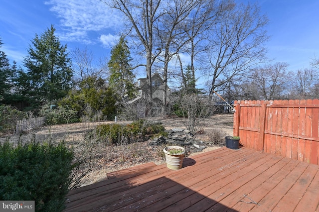 wooden deck featuring fence