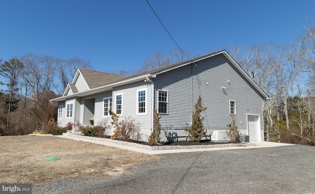 view of side of property featuring central AC unit