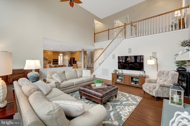 living area featuring visible vents, wood finished floors, recessed lighting, stairway, and ceiling fan