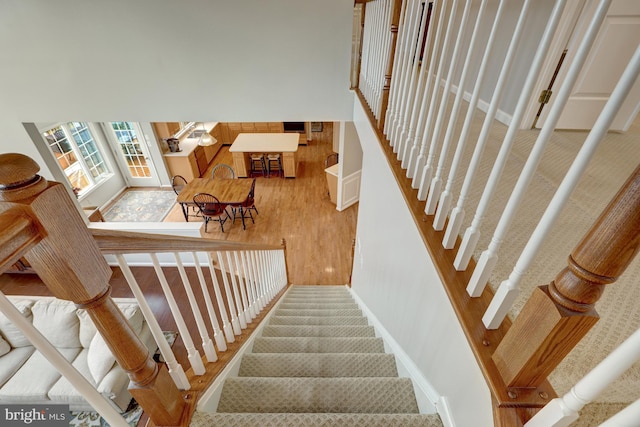 stairway featuring wood finished floors