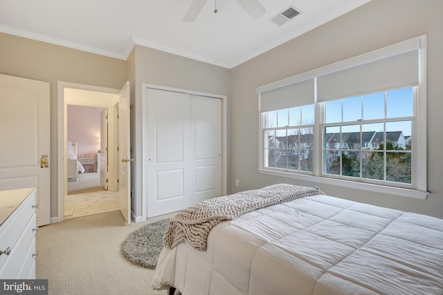 bedroom with visible vents, ornamental molding, light carpet, a closet, and a ceiling fan