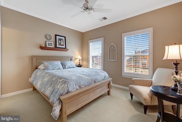 bedroom featuring light carpet, visible vents, crown molding, and baseboards