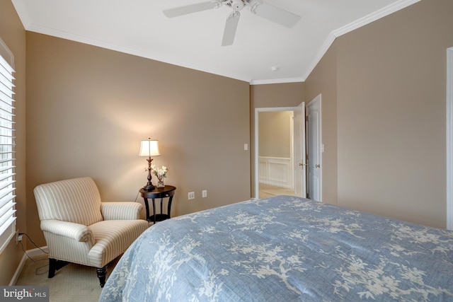 bedroom featuring baseboards, ceiling fan, and crown molding