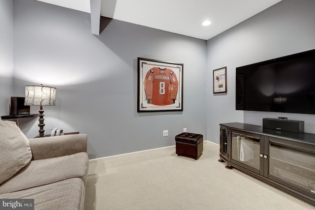 carpeted living room featuring recessed lighting and baseboards