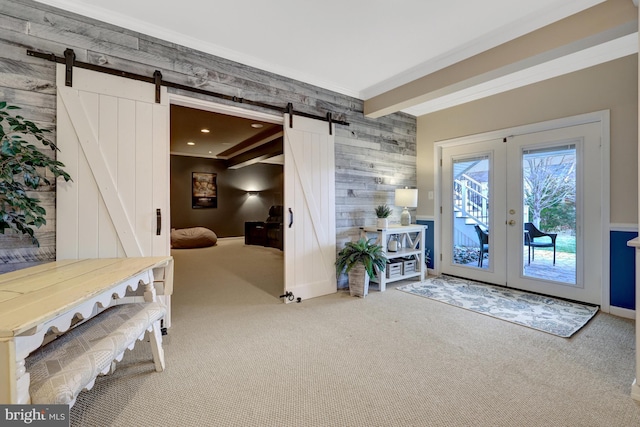 interior space featuring a barn door, carpet floors, beam ceiling, recessed lighting, and french doors