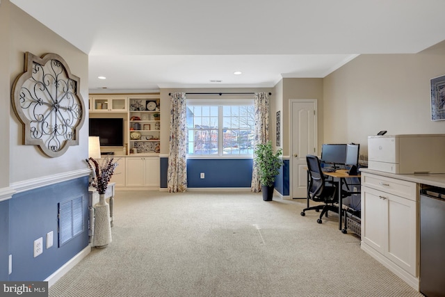 carpeted office space with crown molding, recessed lighting, baseboards, and visible vents