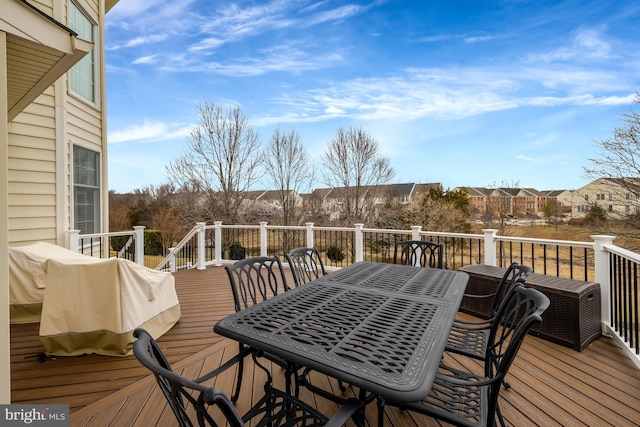 deck featuring outdoor dining area