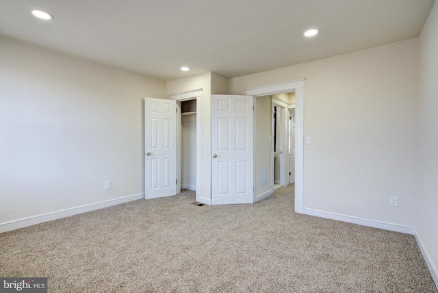 unfurnished bedroom with recessed lighting, carpet, and baseboards