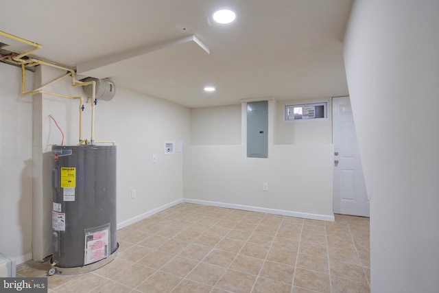 finished below grade area featuring light tile patterned floors, electric panel, baseboards, electric water heater, and recessed lighting