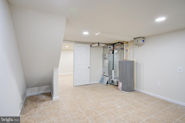 finished basement with water heater, recessed lighting, and baseboards