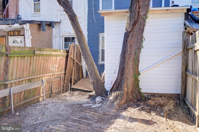 view of side of property with fence private yard and brick siding