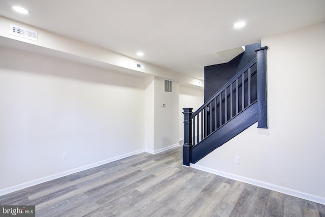 interior space with recessed lighting, visible vents, baseboards, and wood finished floors