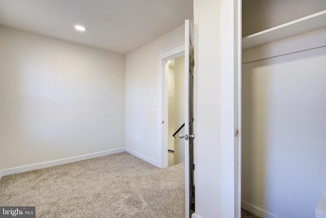 unfurnished bedroom with baseboards, carpet floors, and recessed lighting