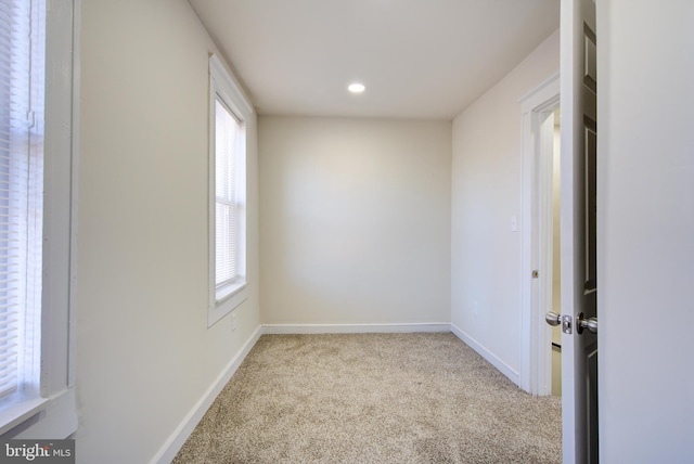 carpeted empty room with recessed lighting and baseboards