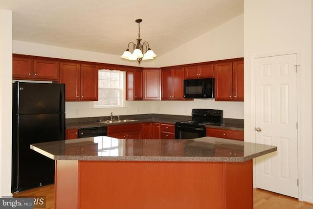kitchen with pendant lighting, a sink, vaulted ceiling, black appliances, and an inviting chandelier