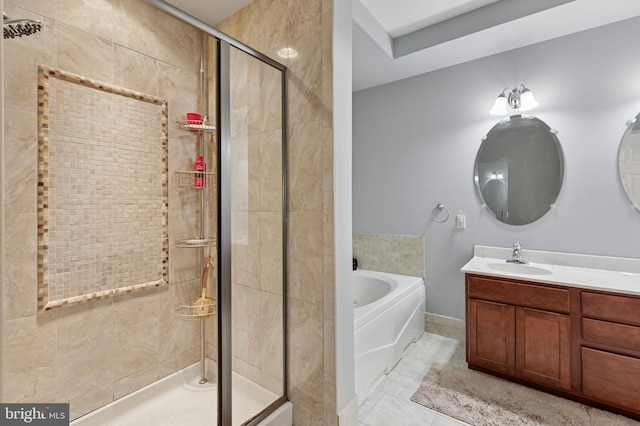 bathroom with a stall shower, vanity, and a bath