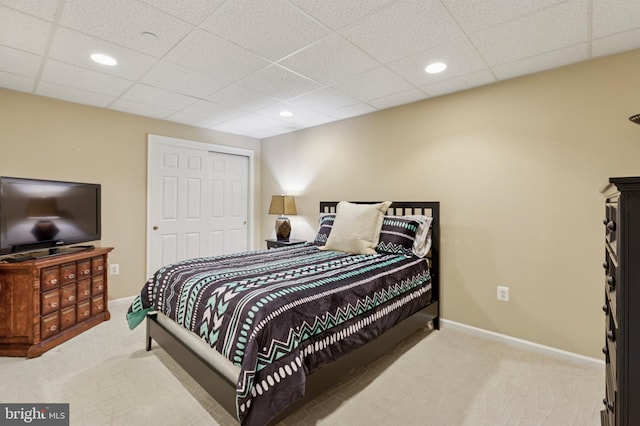 bedroom with carpet, a closet, baseboards, and recessed lighting