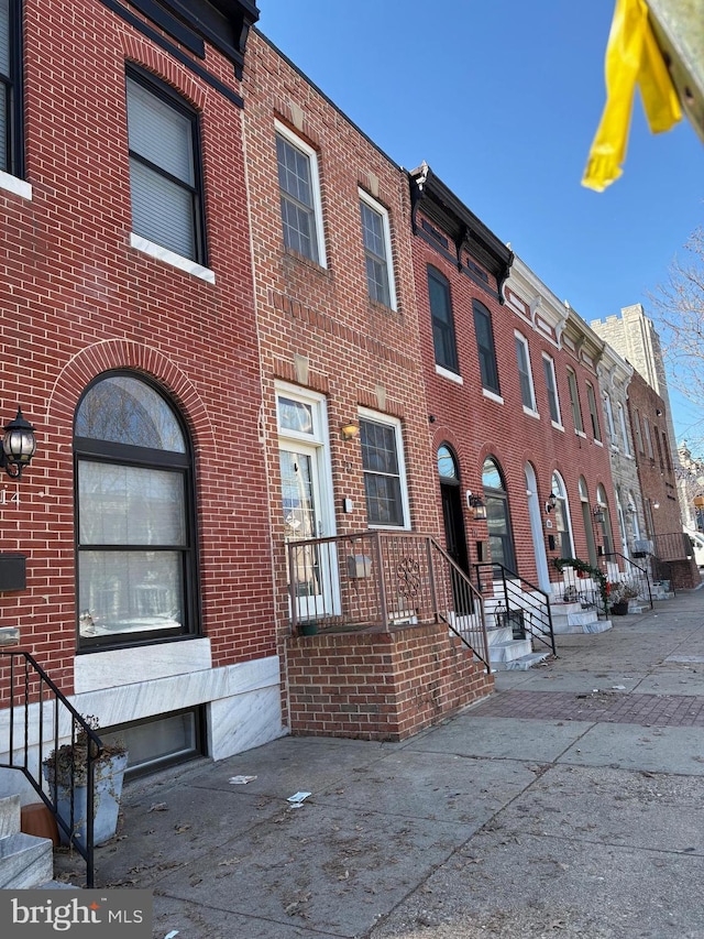 view of front of home with brick siding