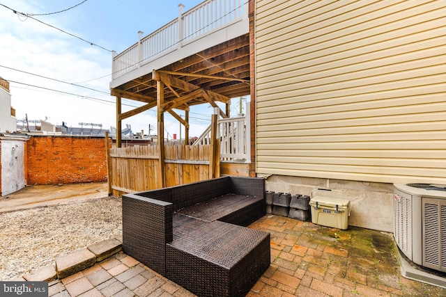 view of patio with fence and central air condition unit