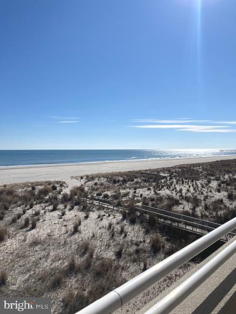 view of water feature with a beach view