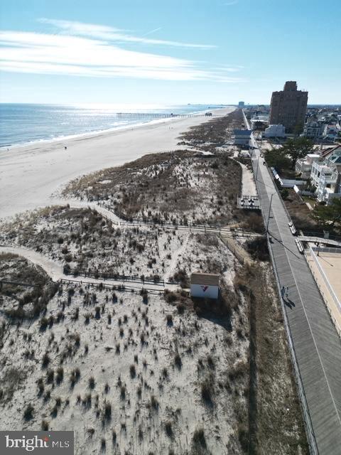 aerial view with a beach view and a water view