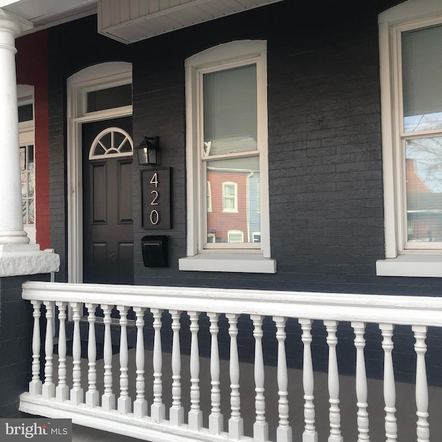 property entrance with brick siding