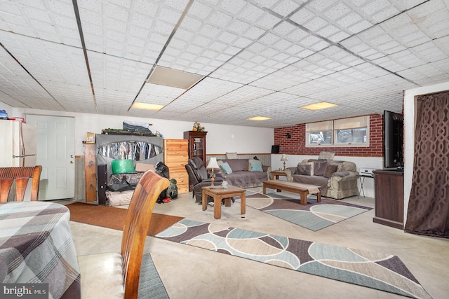 living area with concrete floors