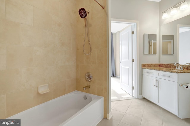 bathroom with  shower combination, tile patterned flooring, and vanity