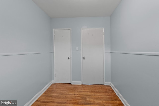 unfurnished bedroom featuring wood finished floors