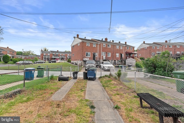 view of front of house with fence and a residential view