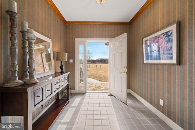 entryway with baseboards, crown molding, tile patterned floors, and wallpapered walls