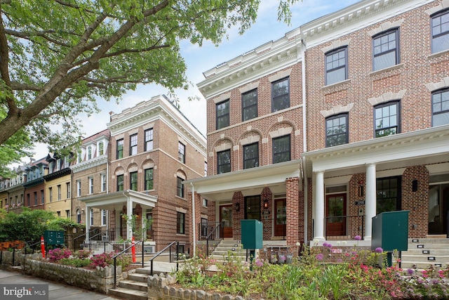 view of front of home featuring brick siding