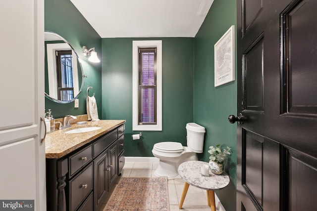 1619 Marion St NW, Washington, DC 20001 - bathroom with toilet, vanity, baseboards, tile patterned flooring, and healthy amount of natural light