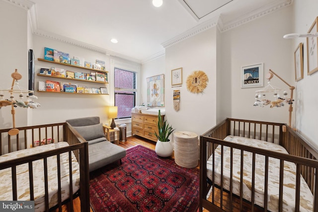 1619 Marion St NW, Washington, DC 20001 - bedroom featuring ornamental molding, light wood-style flooring, a nursery area, recessed lighting, and attic access
