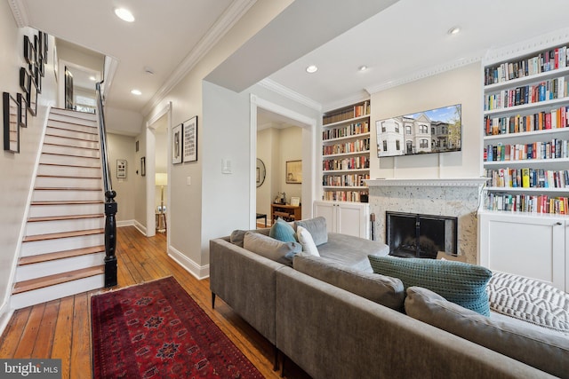 1619 Marion St NW, Washington, DC 20001 - living area featuring hardwood / wood-style floors, baseboards, built in shelves, a fireplace, and stairs