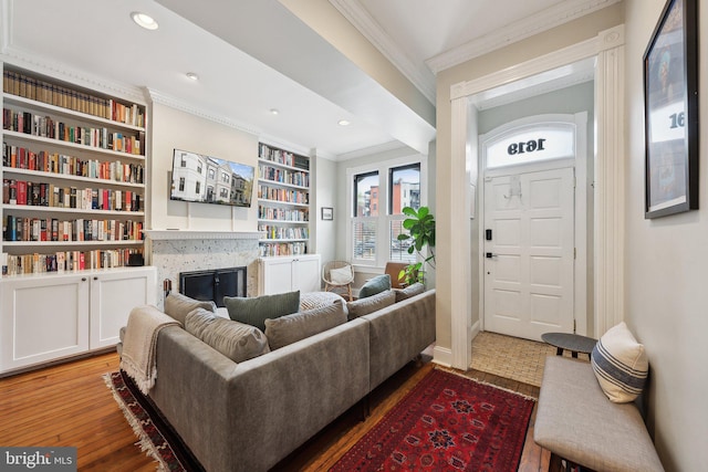 1619 Marion St NW, Washington, DC 20001 - living area featuring crown molding, a fireplace, wood finished floors, baseboards, and built in features