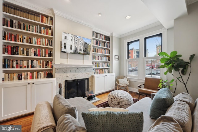 1619 Marion St NW, Washington, DC 20001 - sitting room featuring crown molding, light wood-type flooring, baseboards, a high end fireplace, and built in shelves