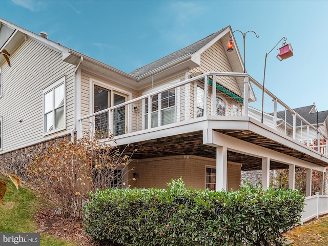 view of property exterior with brick siding