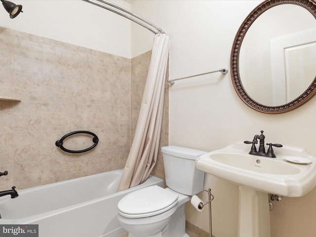 bathroom with shower / bathtub combination with curtain and toilet