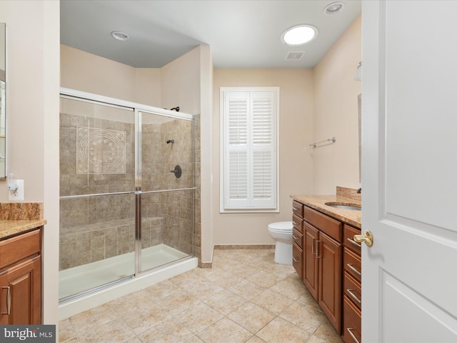 full bathroom with visible vents, toilet, a stall shower, and vanity