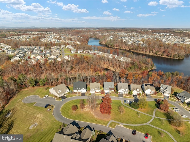 aerial view featuring a residential view and a water view