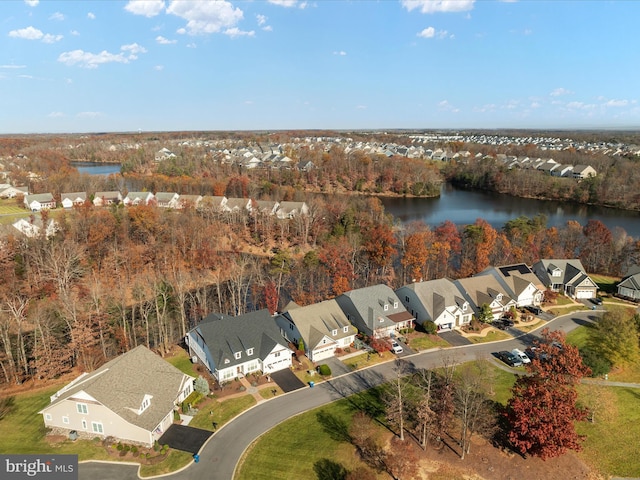 drone / aerial view featuring a water view and a residential view